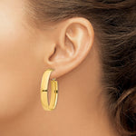 Load image into Gallery viewer, 14K Yellow Gold High Polished 7mm Omega Back Oval Hoop Earrings