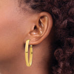 Load image into Gallery viewer, 14K Yellow Gold High Polished 5mm Omega Back Oval Hoop Earrings