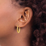 Load image into Gallery viewer, 14K Yellow Gold Polished Twisted Hollow Hoop Earrings 13mm length