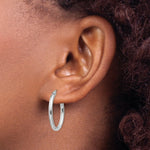 Load image into Gallery viewer, 14K White Gold Polished 2mm Oval Tube Hoop Earrings 14mm length