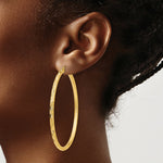 Load image into Gallery viewer, 14K Yellow Gold Textured Hoop Earrings 60mm length