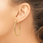 Load image into Gallery viewer, 14K Yellow Gold Diamond-cut 2mm Round Tube Hoop Earrings  45mm length
