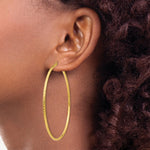Load image into Gallery viewer, 14K Yellow Gold Diamond-cut 2mm Round Tube Hoop Earrings  65mm length
