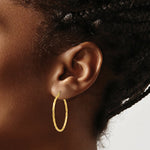 Load image into Gallery viewer, 14K Yellow Gold Twist Polished Hoop Earring 26mm length

