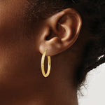 Load image into Gallery viewer, 14K Yellow Gold Knife Edge Diamond-cut 2.5x25mm Hollow Hoop Earrings  25mm length
