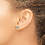 Load image into Gallery viewer, 14k Yellow Gold Polished Light Swiss Blue Topaz Bow Post Earrings
